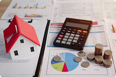 Estate planning mistakes: Miniature house, calculator, coins on tax documents for legal help