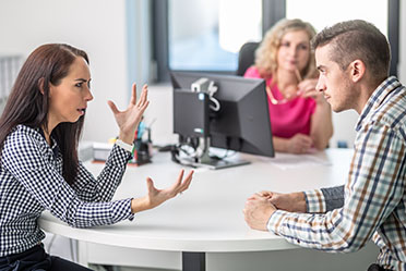 Arguing family members over an estate plan in California, illustrating a potential family feud or probate dispute.