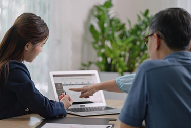 Female financial advisor discussing estate planning with LGBT couple in Orange County, CA